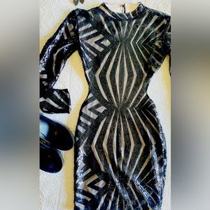 Black backless mini dress with details of black sequins
